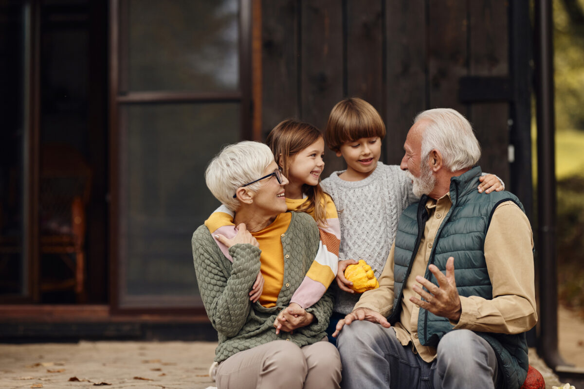 Grandparents laughing with their grandchildren